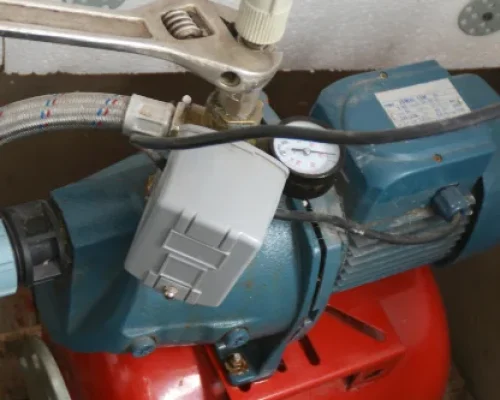 Residential sewage ejector pump system requiring repair and maintenance.